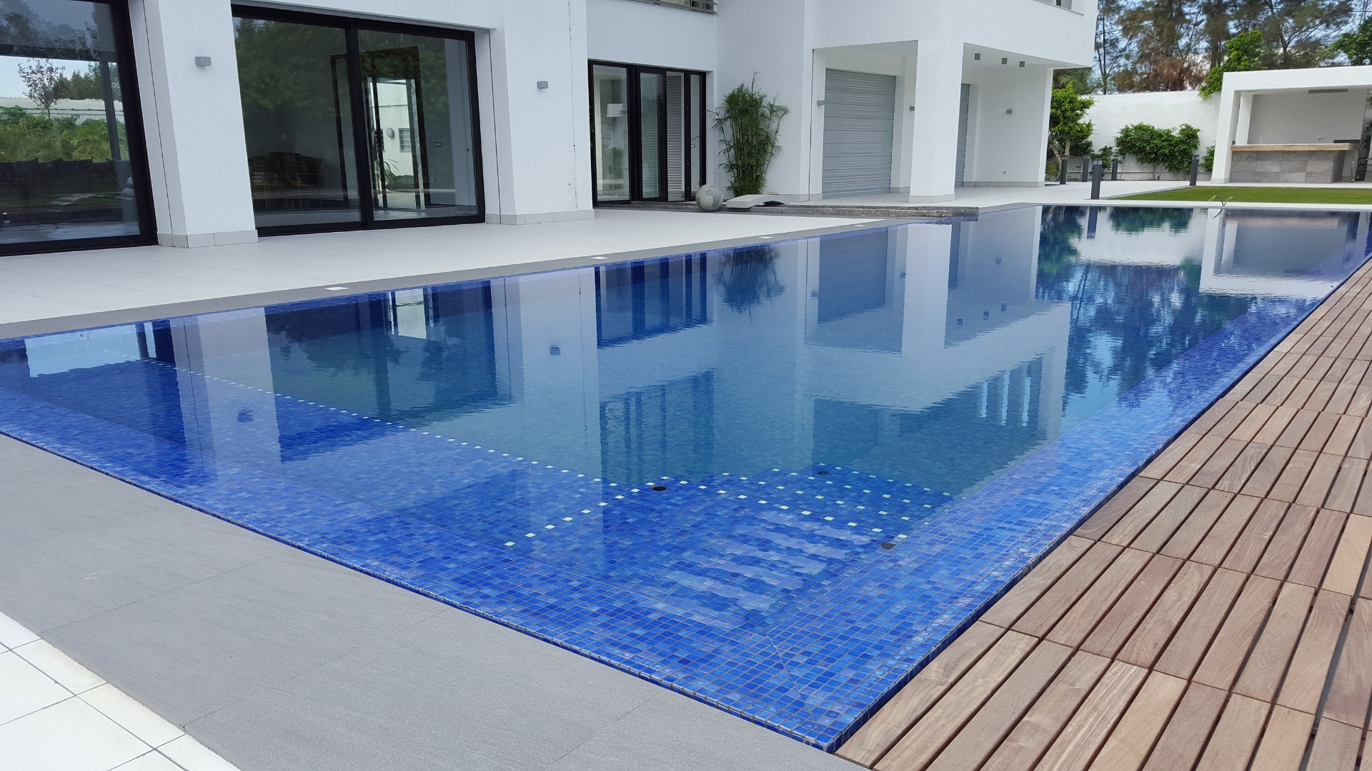 Before and after backyard pool oasis transformation with decking